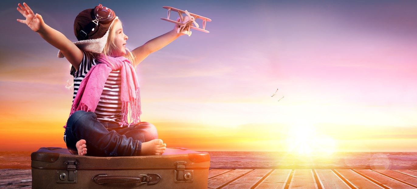 Child traveller at sunset